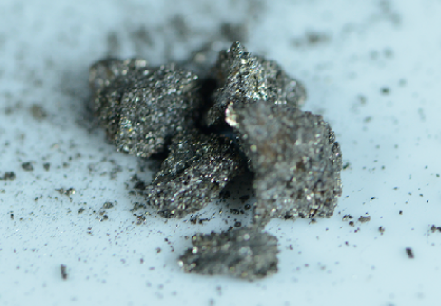 Rare earth element content in magnet