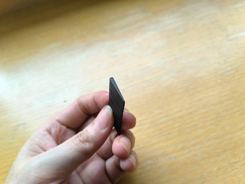 Black coated slender thin triangular curved permanent magnet N52