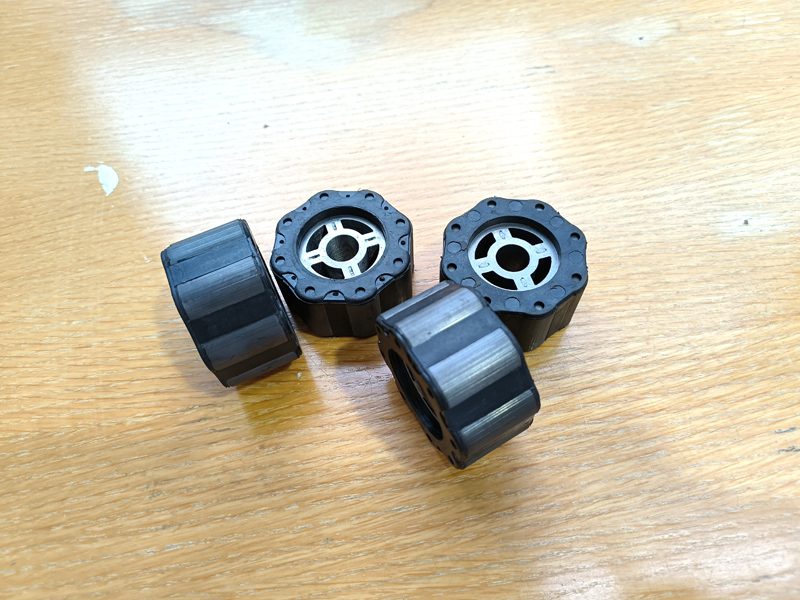 Integrated sintered ferrite arc-shaped magnet with encapsulation